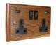 Classic 2G USB Charging Socket in Solid Medium Oak with Black insert.