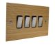 Solo Flat Plate Wood 4 Gang 2Way 10Amp Rocker Switch in Oak with Satin Stainless Rocker and Black Trim