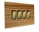 Solo Flat Plate Wood 4 Gang 2Way 10Amp Rocker Switch in Zebrano with Polished Brass Rocker and Black trim