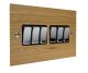 Solo Flat Plate Wood 6 Gang 2Way 10Amp Rocker Switch in  Oak with Polished Stainless Rocker and Black Trim